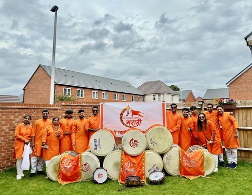Pathak members with the Leamington Marathi banner and drums